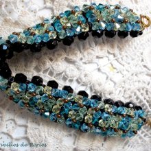 Fonkelende Aurora armband met zwarte facetten en gekleurde tollen in Swarovski kristal